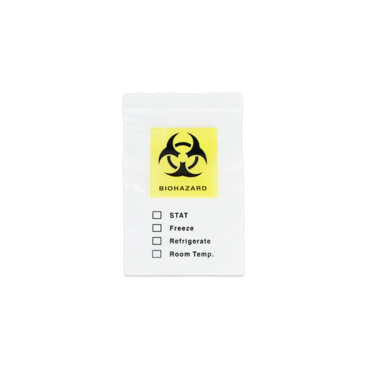 Woreczek biohazard Dvot, wyrób medyczny. Przezroczysta torebka z żółtym polem i czarnym symbolem zagrożenia biologicznego. Poniżej lista opcji zaznaczenia: STAT, Freeze, Refrigerate, Room Temp.